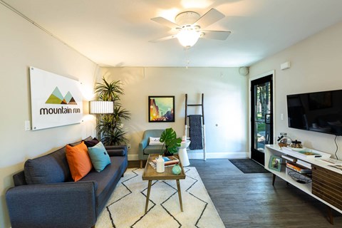 a living room with a couch and a coffee table at Mountain Run Apartments, Orem, UT 