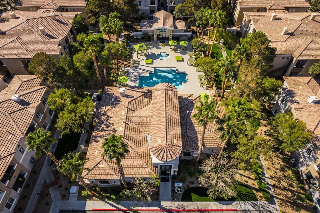 a birds eye view of a house with a pool and trees
