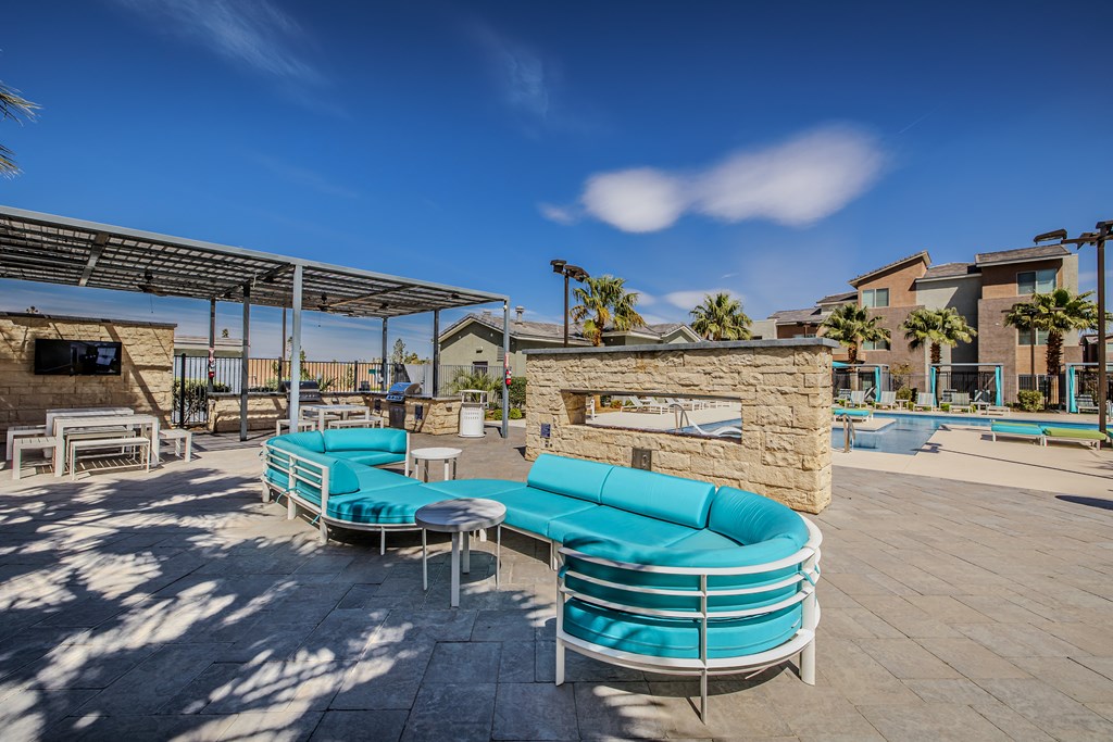 A sunny day at the outdoor seating area with a stone fireplace.