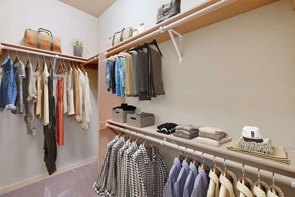 Two Bedroom Apartments in Olympia, WA - Yauger Park Villas - Oversized Closet with Shelving, Carpeted Floors, and Hanging Rods