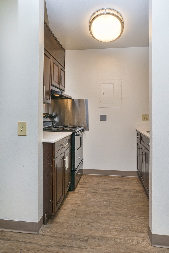 Full kitchen view with light at MIRACLE TERRACE Apartments, Anaheim, CA 92804
