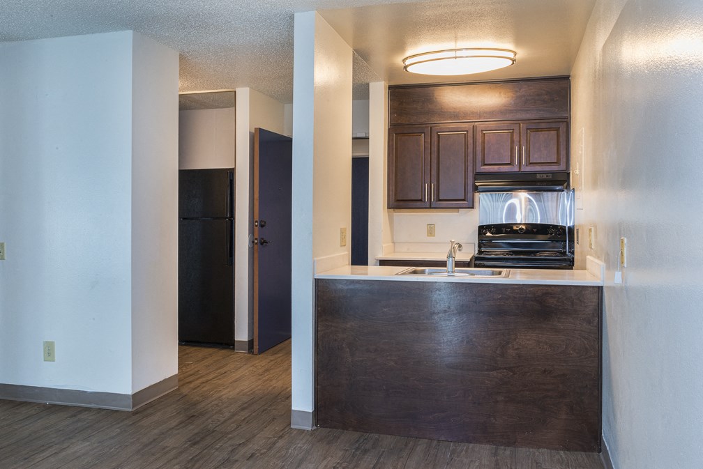Kitchen with view to hall at MIRACLE TERRACE Apartments, Anaheim, CA