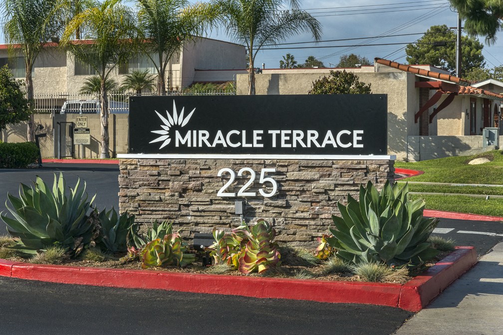 Entry to community monument sign at MIRACLE TERRACE Apartments, Anaheim, CA 92804