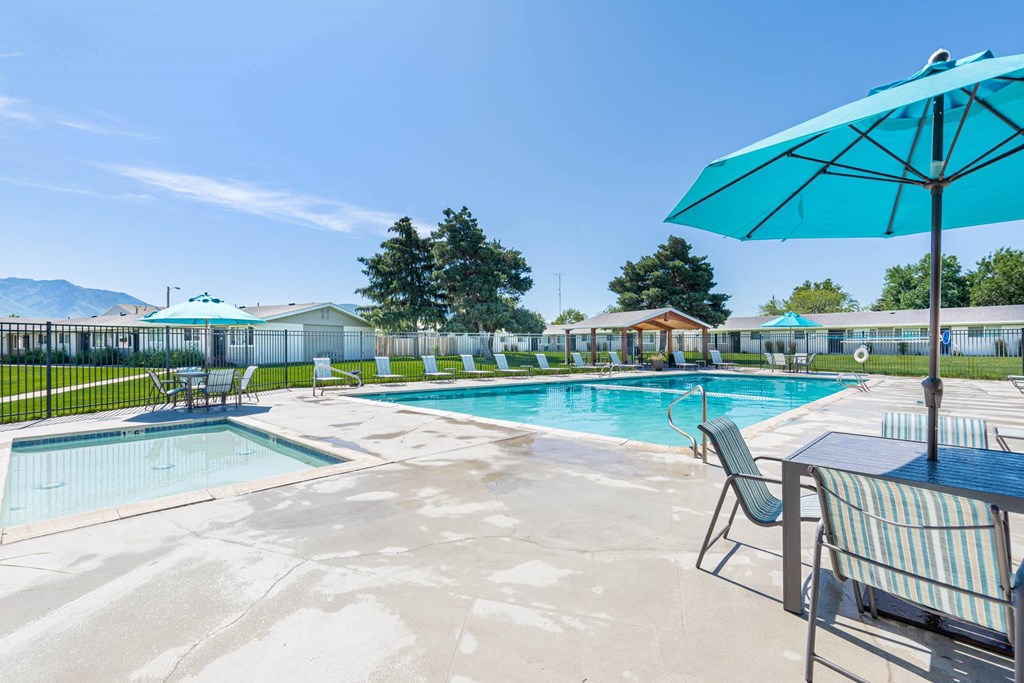 our apartments have a resort style pool and patio at Cadence Apartments, Roy, UT 84067
