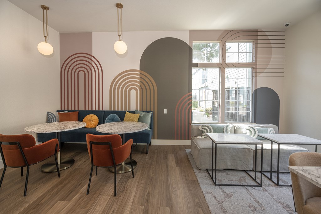 a room filled with furniture and a large window