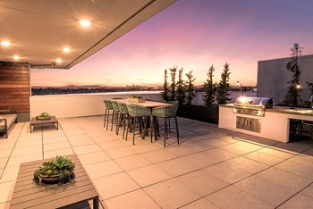 Rooftop seating by BBQ l Orion Apartments in Oakland - Photo Gallery 6