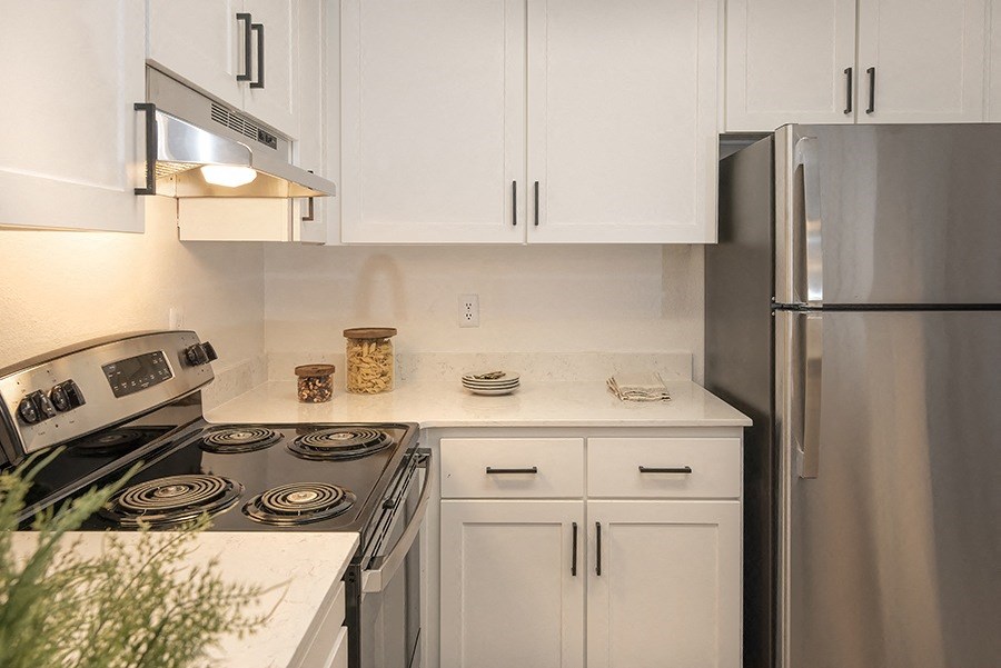 Apartments in Citrus Heights for Rent - The Arlo - Kitchen with Stainless Steel Appliances, Quartz Countertops, and White Cabinets
