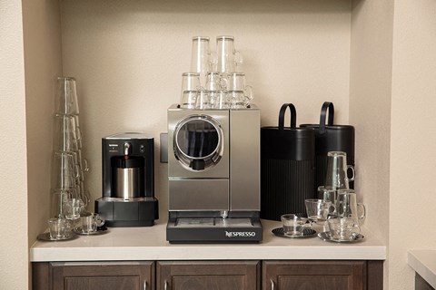 a kitchen with a coffee maker and other appliances on a counter