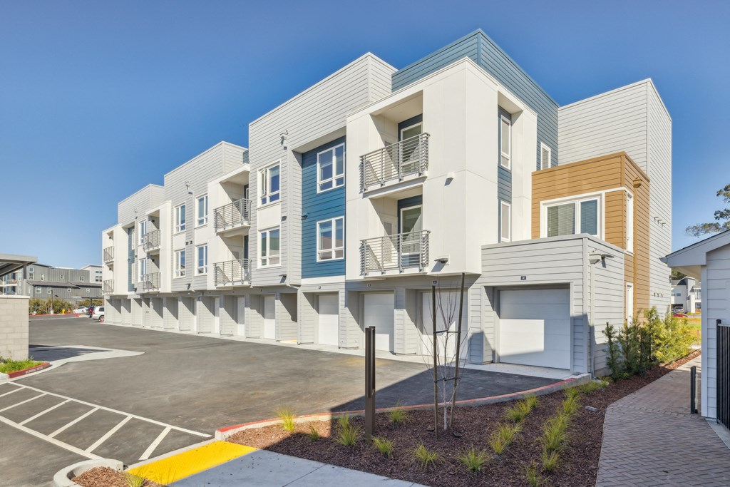 a row of modern apartments with balconies and a parking lot at 38° NORTH, Santa Rosa, CA