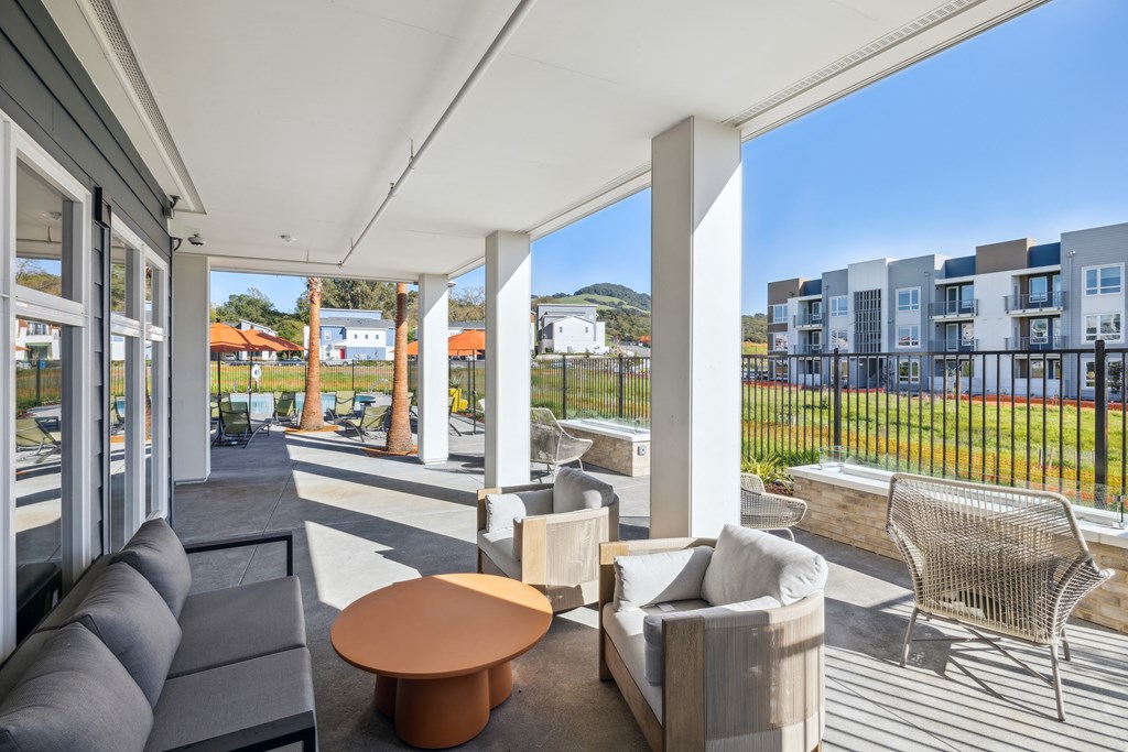 a living room with couches and a coffee table on a balcony at 38° NORTH, Santa Rosa, CA 95404