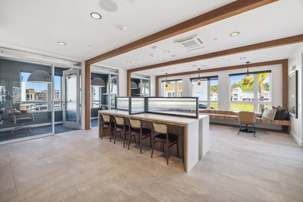 a large kitchen with a bar and chairs in front of it at 38° NORTH, Santa Rosa California