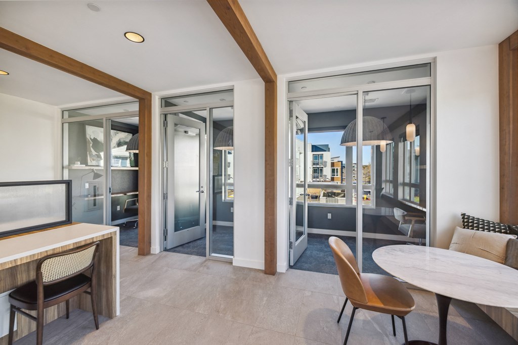 a living room and dining room with sliding glass doors and a view of the city at 38° NORTH, Santa Rosa California