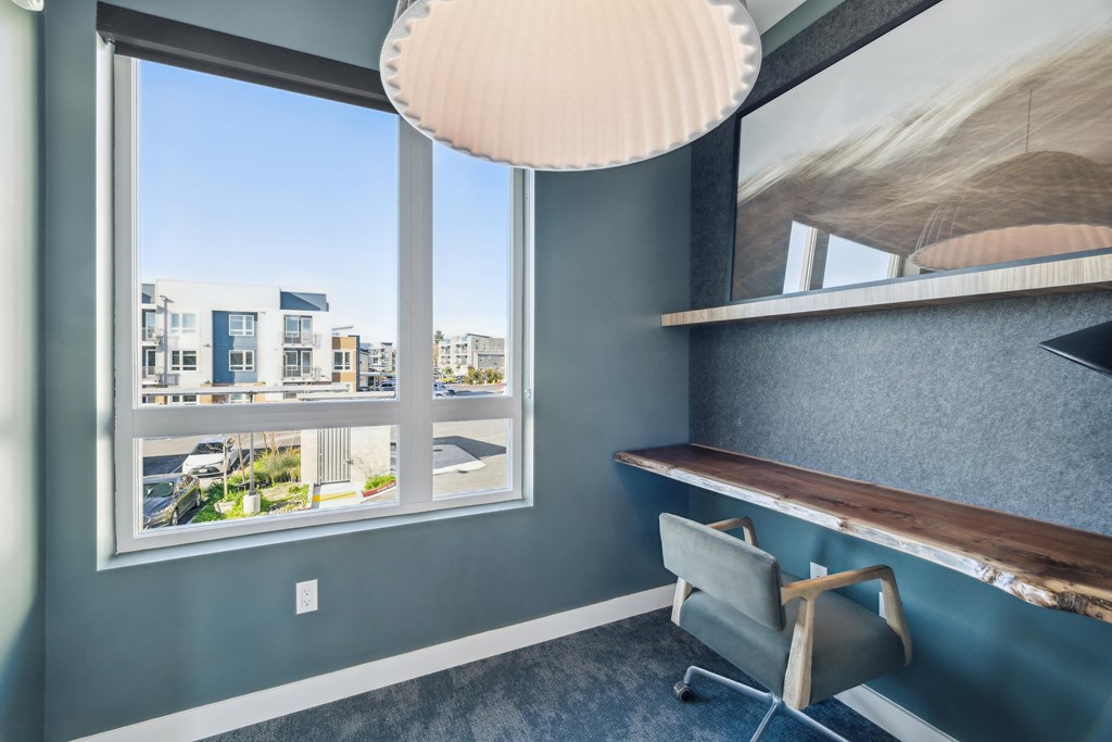 a desk and chair in a room with a window at 38° NORTH, California