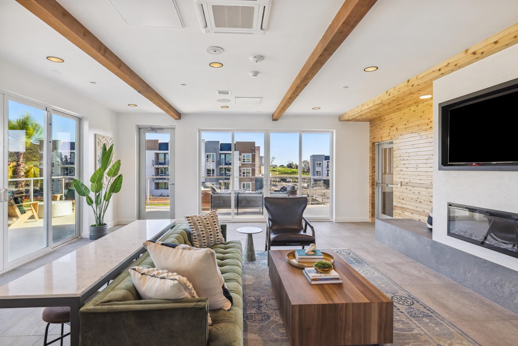 a living room with a couch and a coffee table and a television at 38° NORTH, Santa Rosa, CA