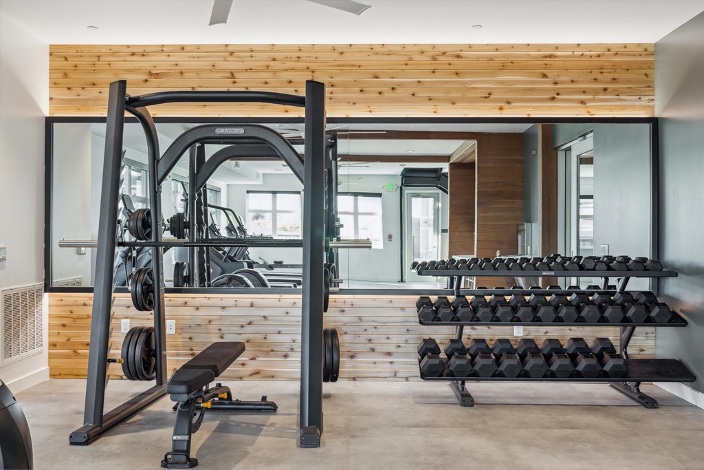 a gym with gym equipment and a wooden wall at 38° NORTH, Santa Rosa, CA 95404