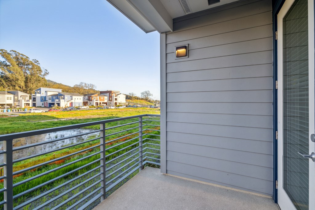 the view from the balcony of a house looking out onto a yard and a river at 38° NORTH, Santa Rosa California