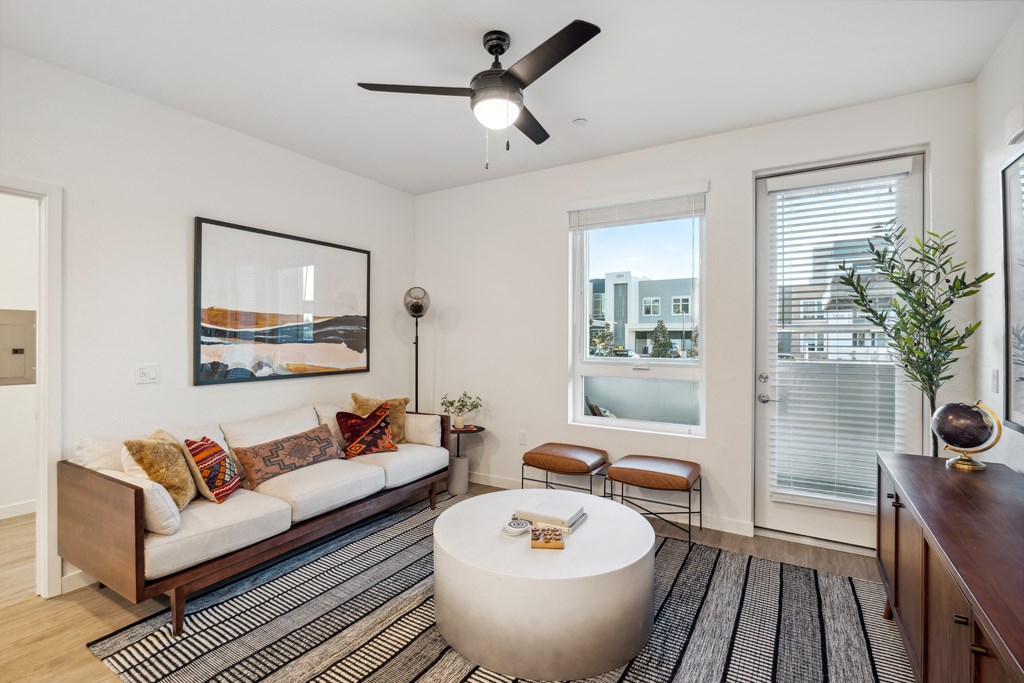 a living room with a couch and a coffee table and a ceiling fan at 38° NORTH, Santa Rosa, 95404