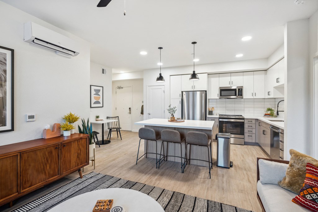 a living room with a kitchen and a table with chairs at 38° NORTH, Santa Rosa, CA 95404