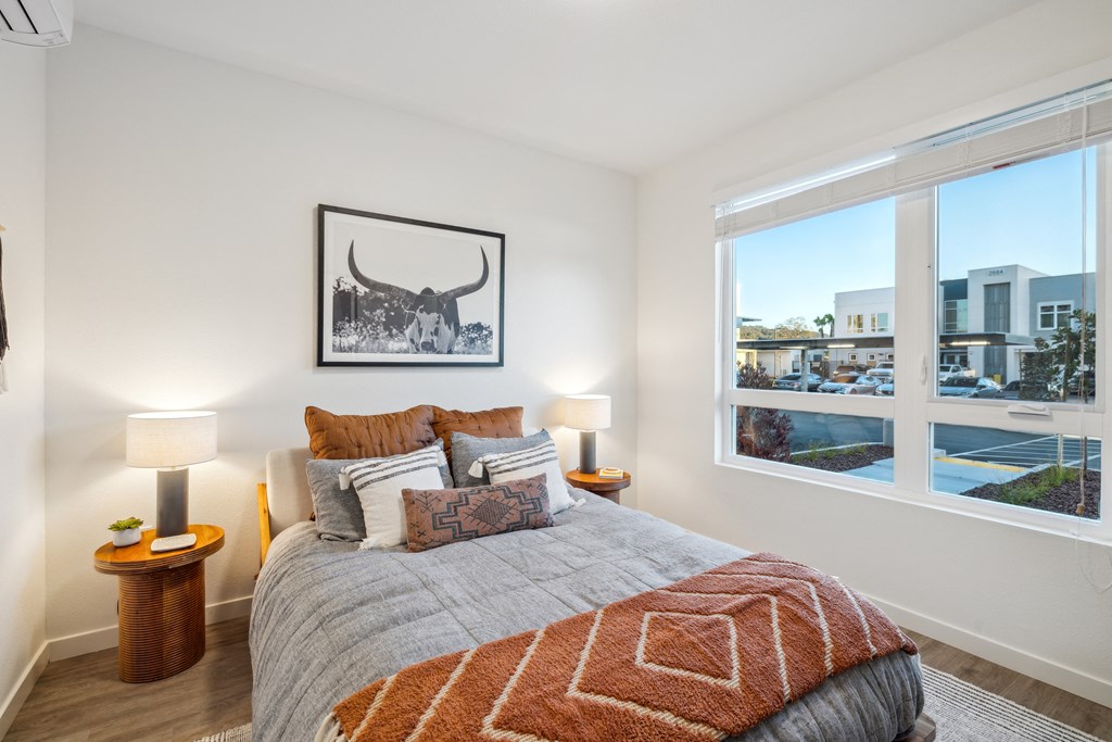a bedroom with a bed and a window with a city view at 38° NORTH, Santa Rosa, CA