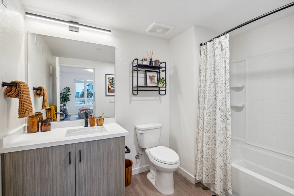 a bathroom with a toilet and a shower and a sink at 38° NORTH, California, 95404