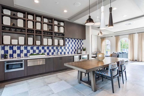 a kitchen with a table and chairs in a house