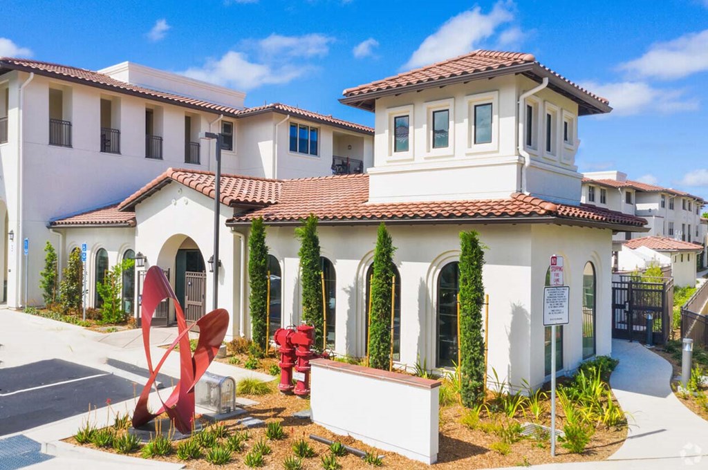 Livermore Apartments for Rent | Ageno | Leasing Office with Apartment Complex View, Manicured Landscaping, and Paved Entrance