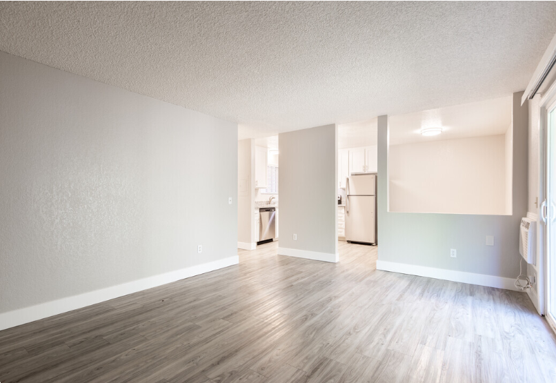 LIving room with wood floors near kitchen