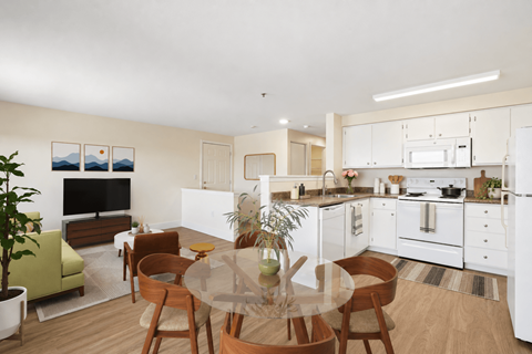 A modern kitchen with a dining table and chairs.