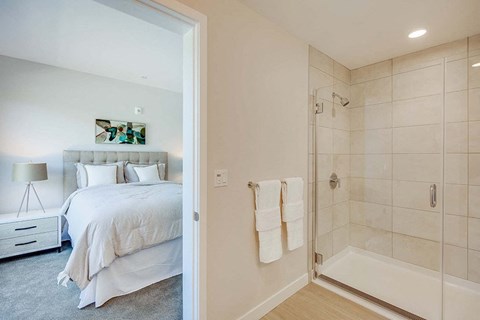 a bedroom with a bed and a bathtub