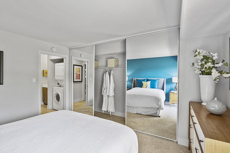 Two Bedroom Apartments in Sunnyvale, CA - Citra - Master Bedroom with Bed, Two Door Mirror Closet and Bathroom with Washer and Dryer