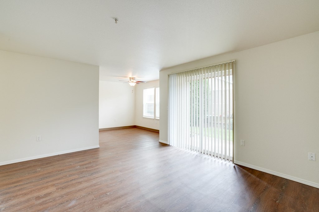 Living room with balcony at THE VILLAGE Apartments, KEIZER,  97303