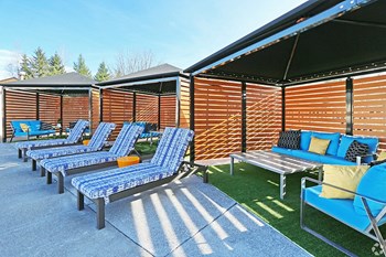 Clock Tower Village pool with lounge chairs - Photo Gallery 26