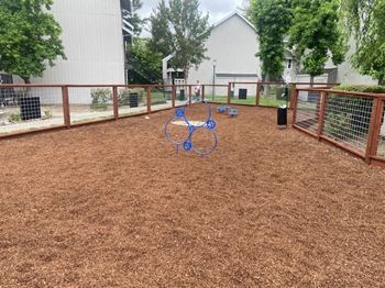 a playground with a bike rack in the middle of it