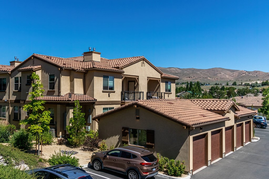 a large house with cars parked in front of it