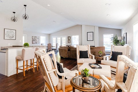 A living room with a white couch and a coffee table.