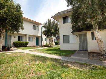 Community buildings near grass and sidewalks - Photo Gallery 2
