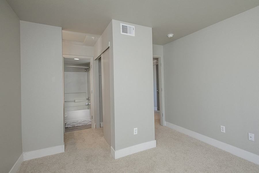 Bedroom with bath and carpet