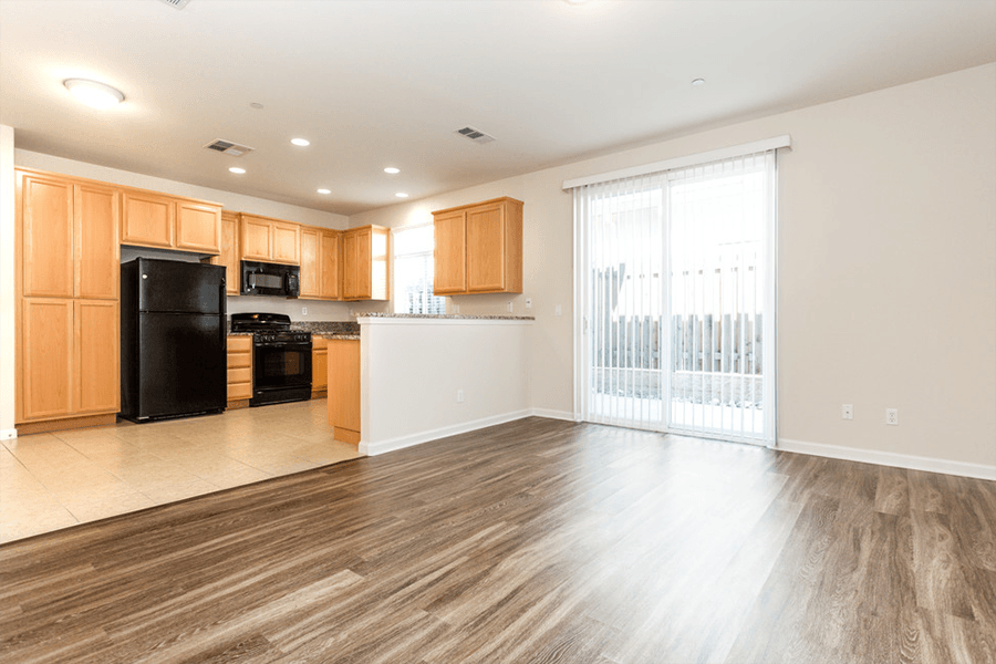 Townhouses in Rocklin CA - The Terraces at Stanford Ranch - Kitchen with Wood-Style Cabinets and Modern Appliances