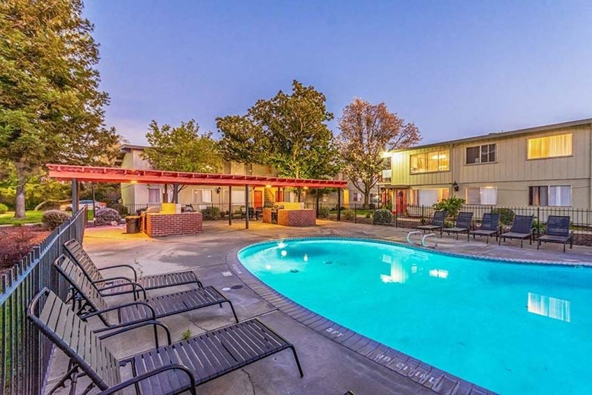 Pool with lounge chairs l Cottage Bell Apartments in Sacramento CA - Photo Gallery 1