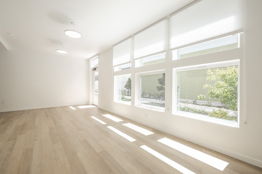 Large room with window and wood floors at FARM BY VINTAGE, MILL CREEK, WA
