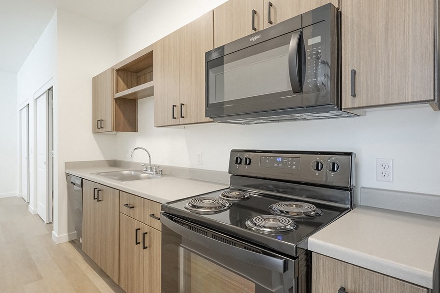 Modern Kitchen with Wood-Style Cabinets at FARM BY VINTAGE, MILL CREEK, WA 98012