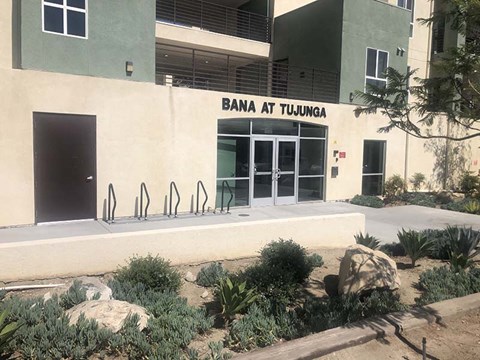 Exterior view of entrance to community with landscape 