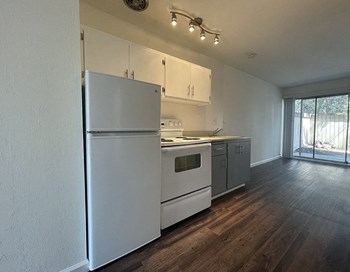 Apartments in North Oakland CA - Open Layout Kitchen Fully Equipped with Convenient Amenities Such As Fridge and Stove - Photo Gallery 4