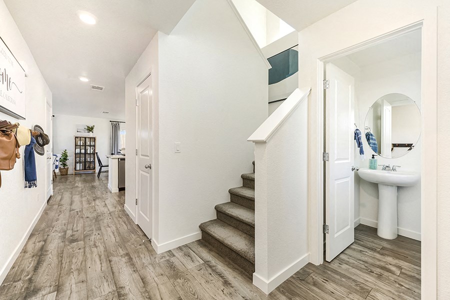 Entry door with stair case and bathroom