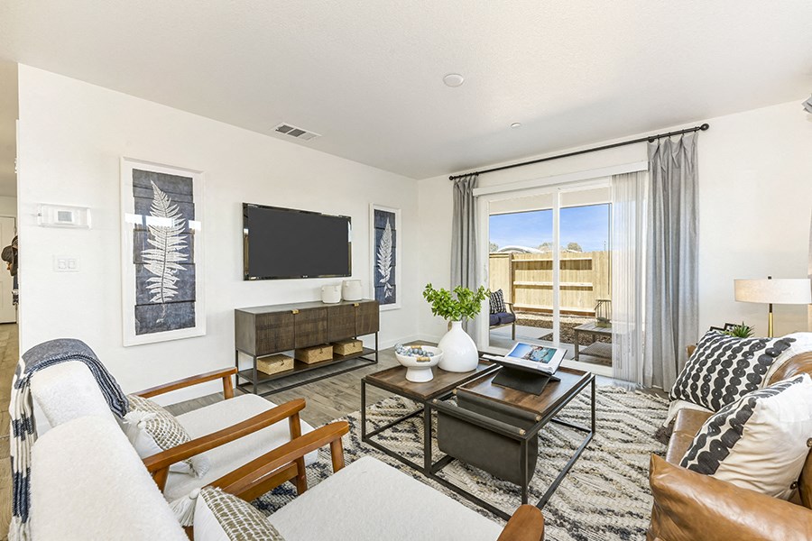 Roseville, CA Homes for Rent Near Top Golf - Isles - Living Room with Sliding Glass Door to the Patio, Hardwood-Style Plank Flooring, and Stylish Decor