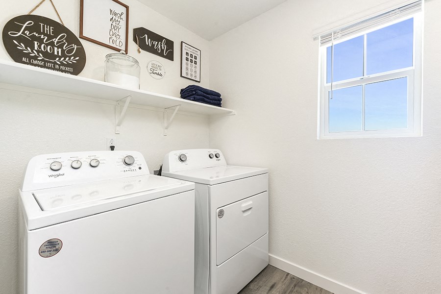 Washer and dryer in room with window