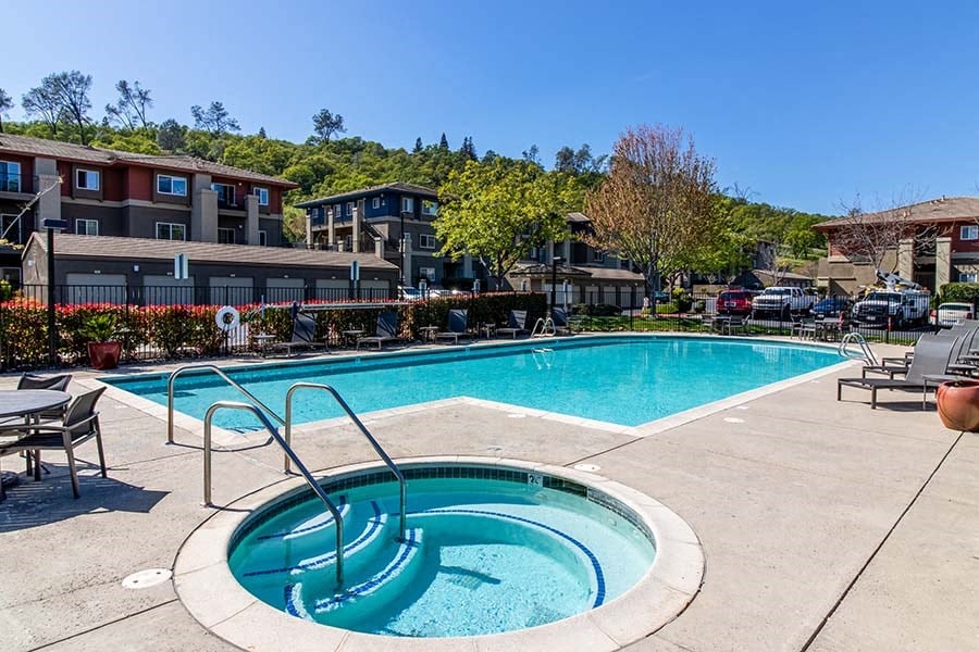 El Dorado Hills CA Apartments - Sterling Ranch Apartments - Swimming Pool and Spa with Lounge Seating and Basketball Court in Background