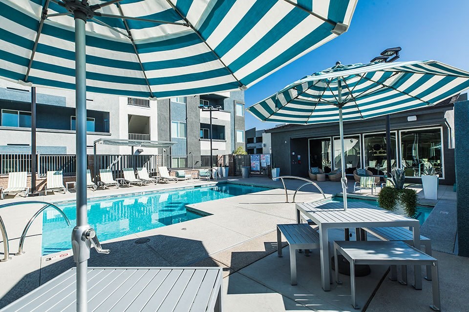 Pool with seating and lounge chairs 
