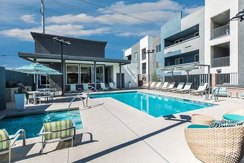 Pool and spa with lounge chairs at THE RISE APARTMENT HOMES, Las Vegas, NV, 89139