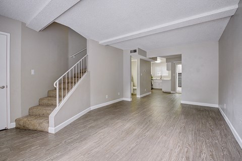 Living room with view of stairs
